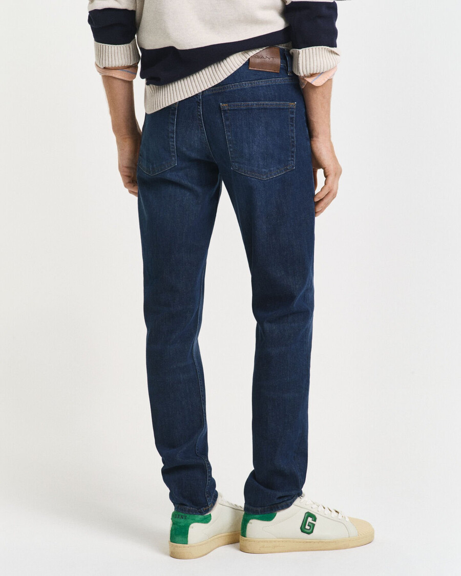 calça jeans slim fit - azul escuro com efeito desgastado