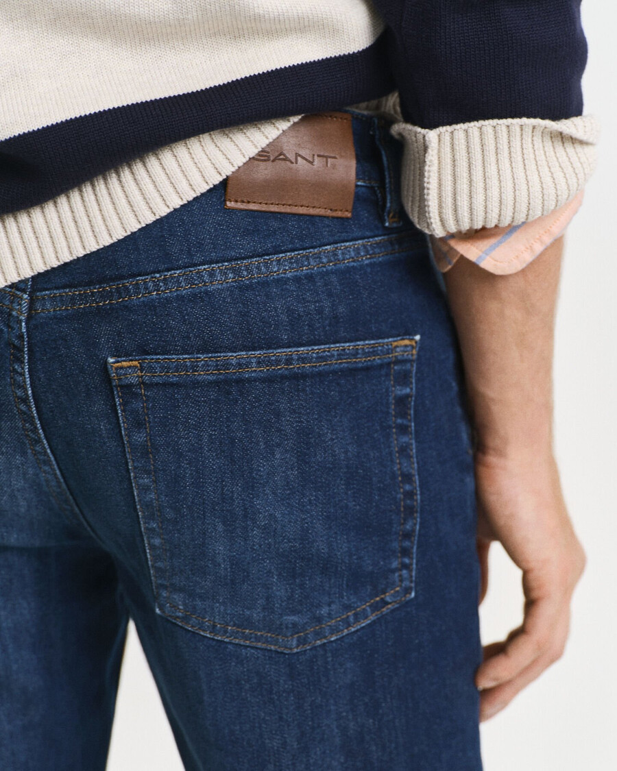calça jeans slim fit - azul escuro com efeito desgastado