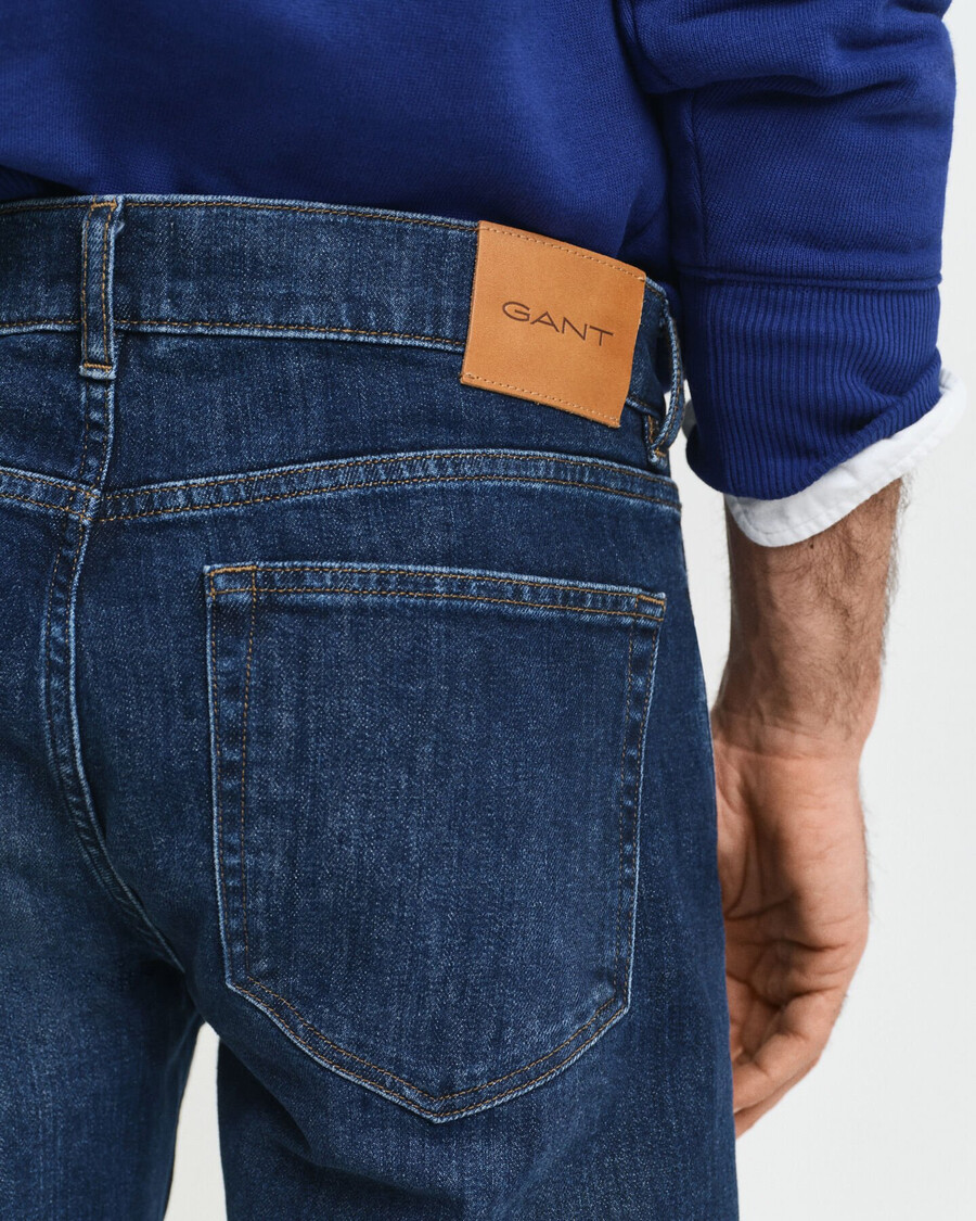 calça jeans de corte reto - azul escuro com efeito desgastado