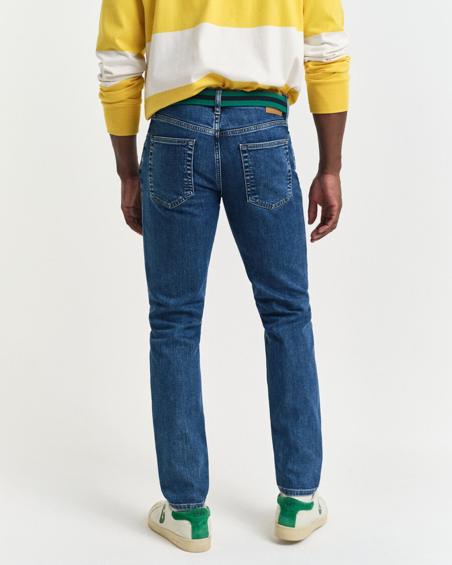 calça jeans slim fit com lavagem clara - azul médio vintage