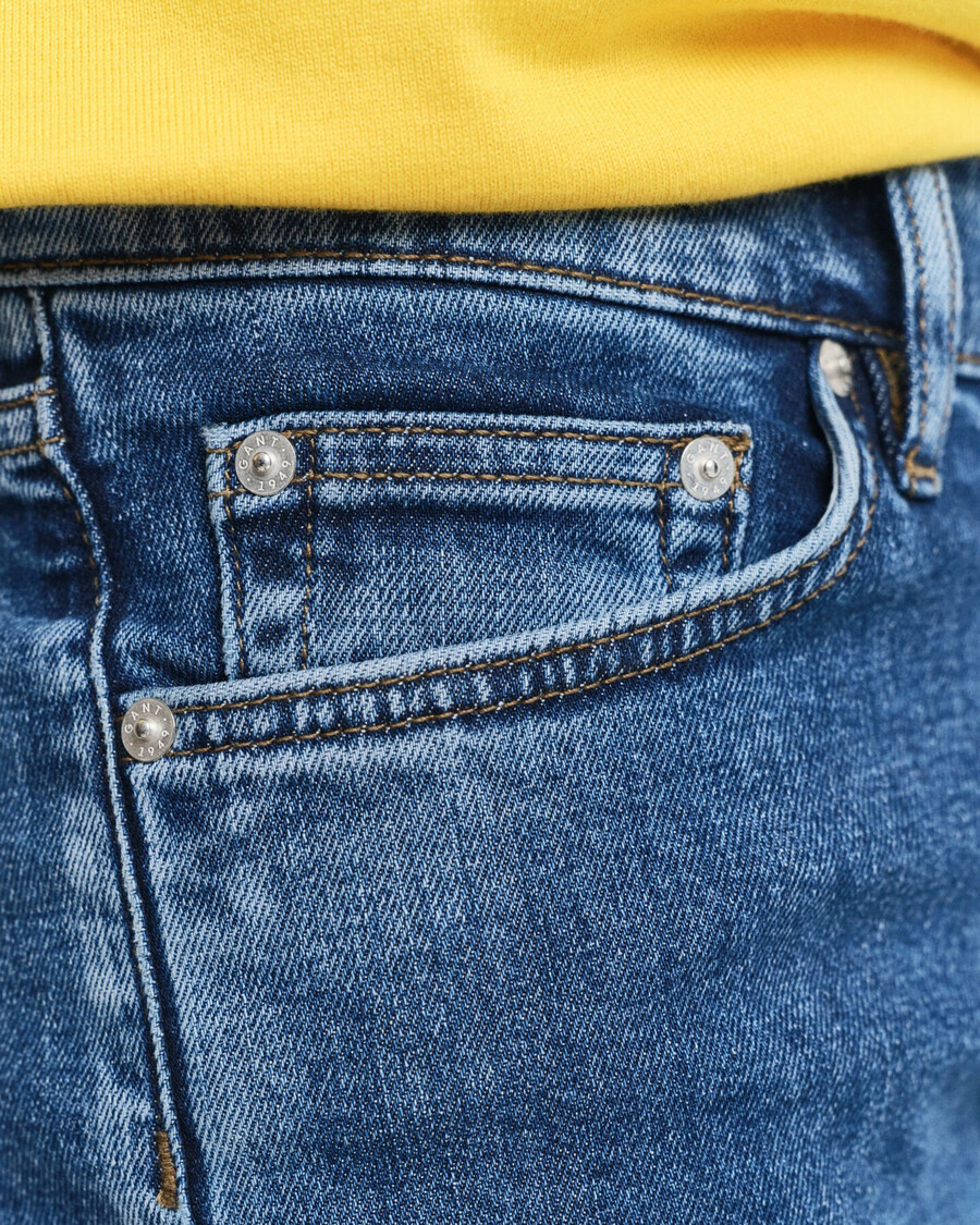 calça jeans slim fit com lavagem clara - azul médio vintage