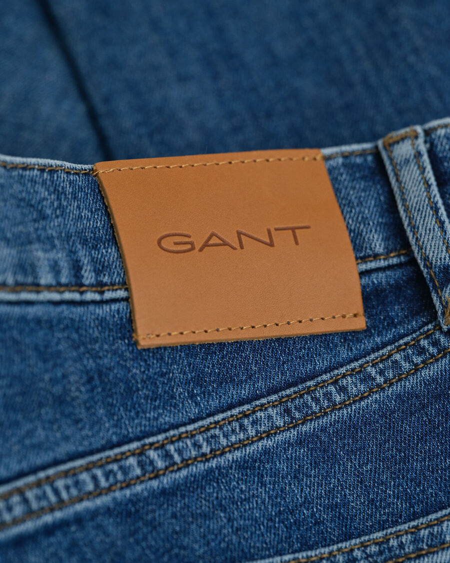 calça jeans slim fit com lavagem clara - azul médio vintage