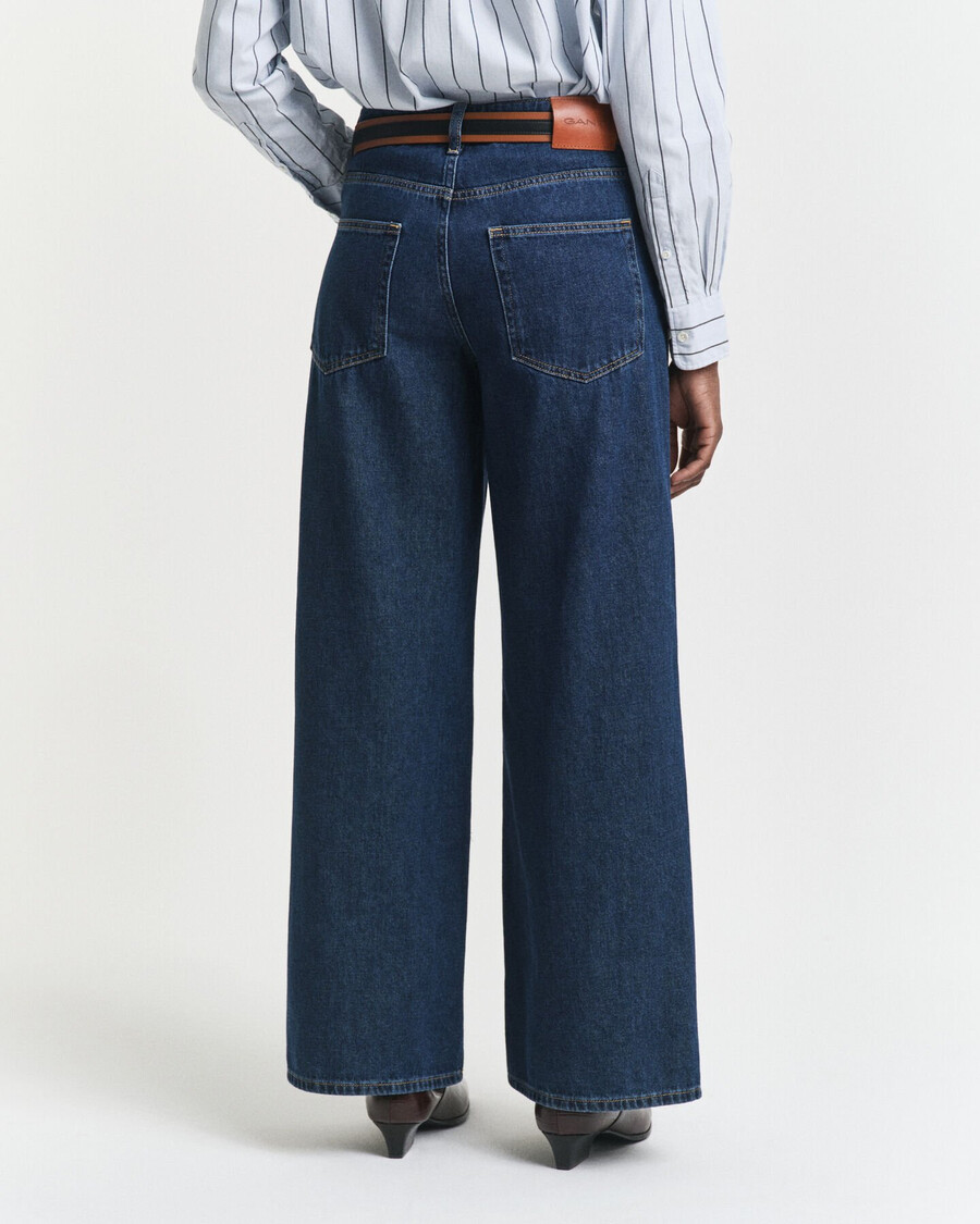 calça jeans de cintura baixa e pernas largas - azul escuro com efeito desgastado