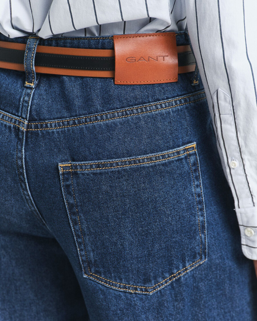 calça jeans de cintura baixa e pernas largas - azul escuro com efeito desgastado