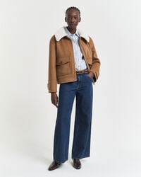 calça jeans de cintura baixa e pernas largas - azul escuro com efeito desgastado